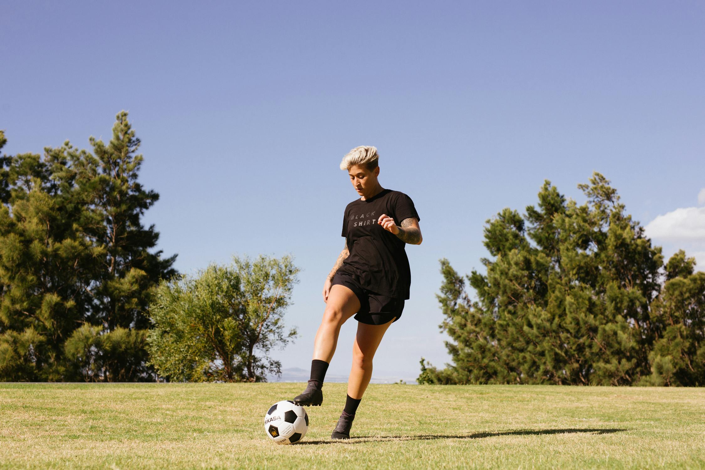 Soccer player kicking the soccer ball